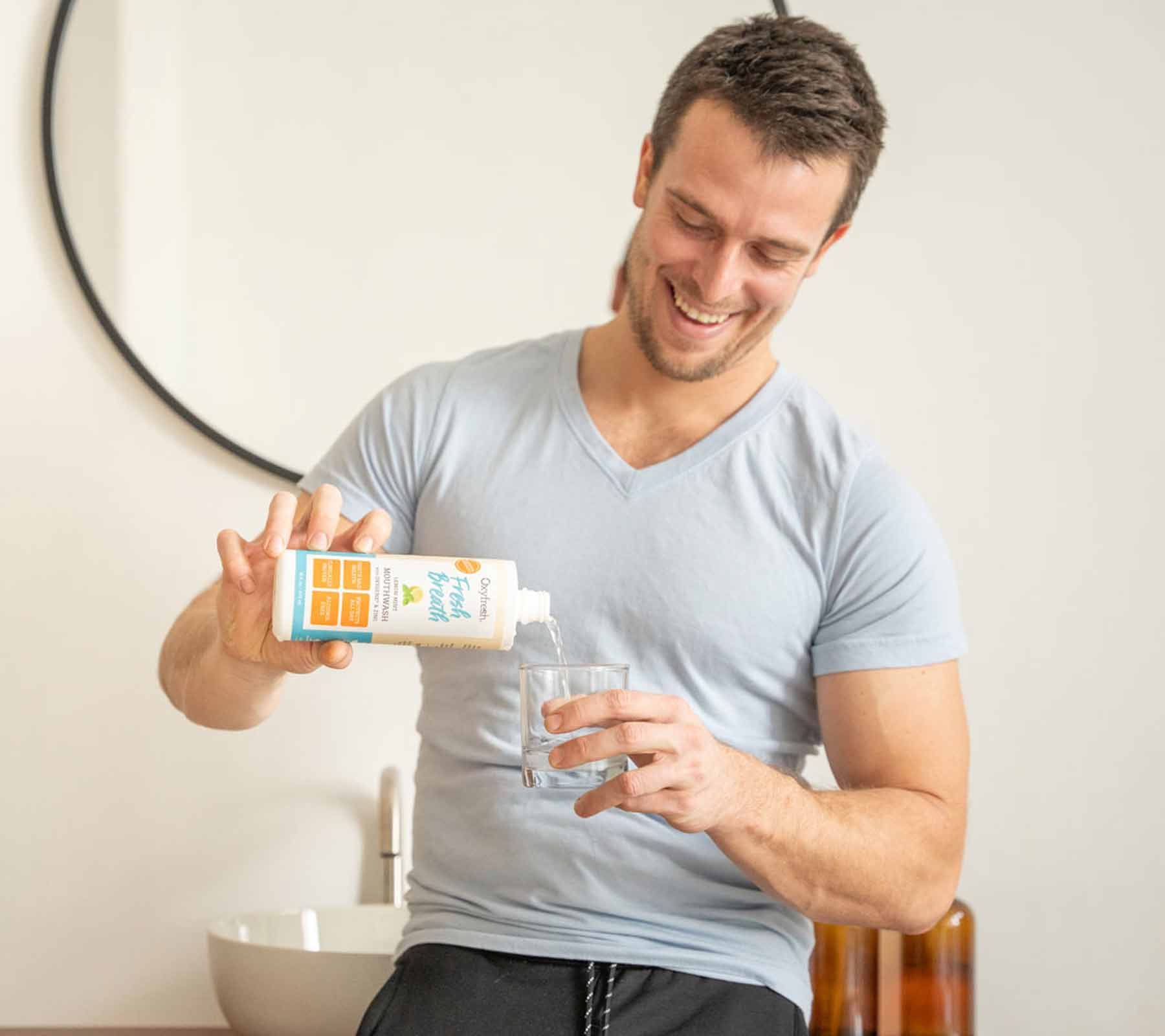 oxyfresh-guy-pouring-lemon-mint-mouthwash