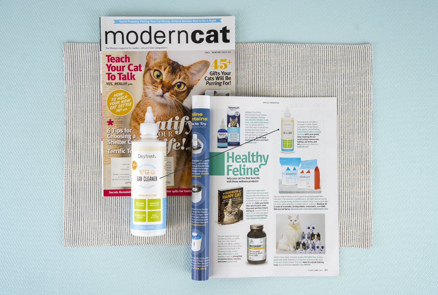 oxyfresh pet ear cleaner next to article in Modern Cat magazine