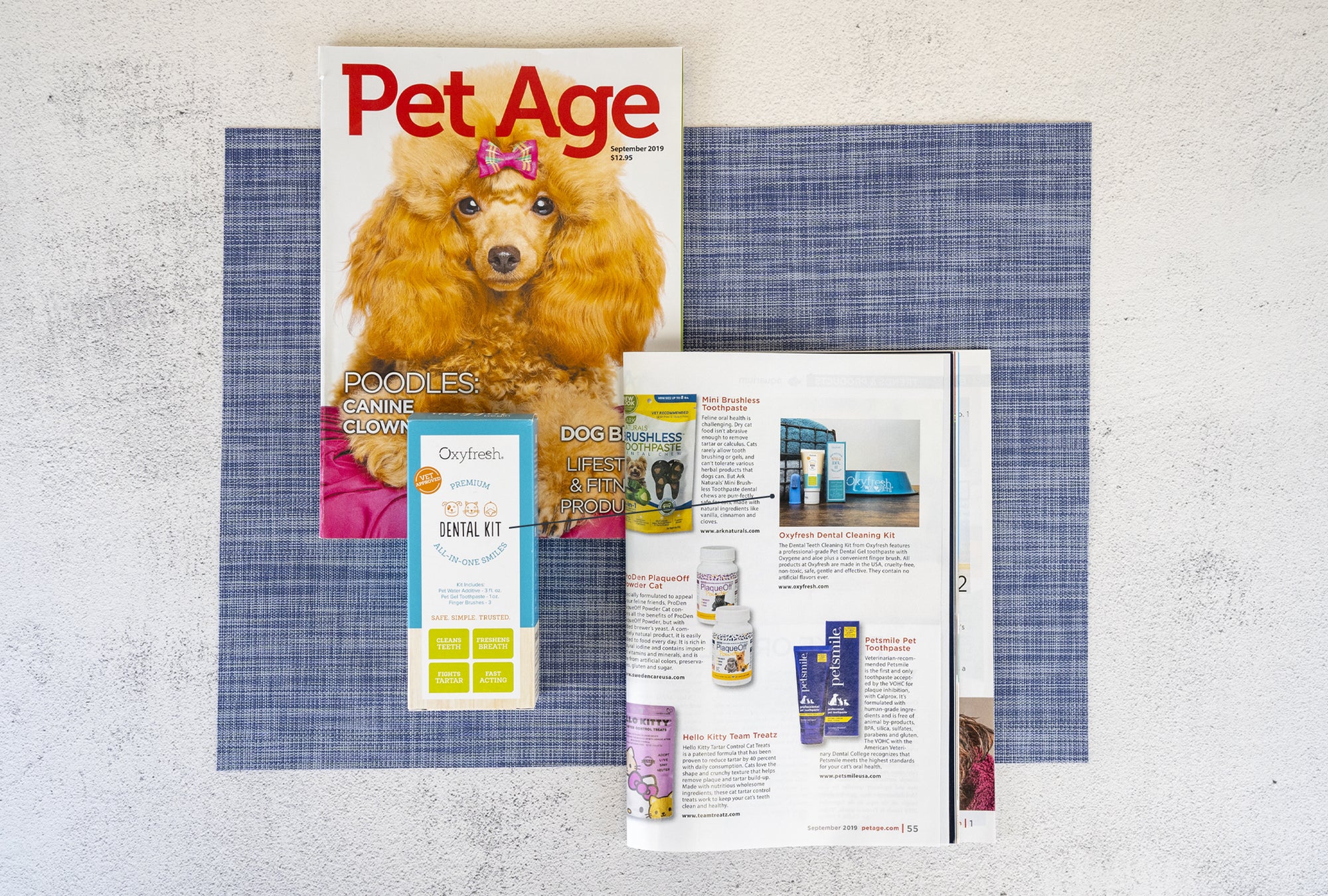 oxyfresh pet dental kit next to article in Pet Age magazine