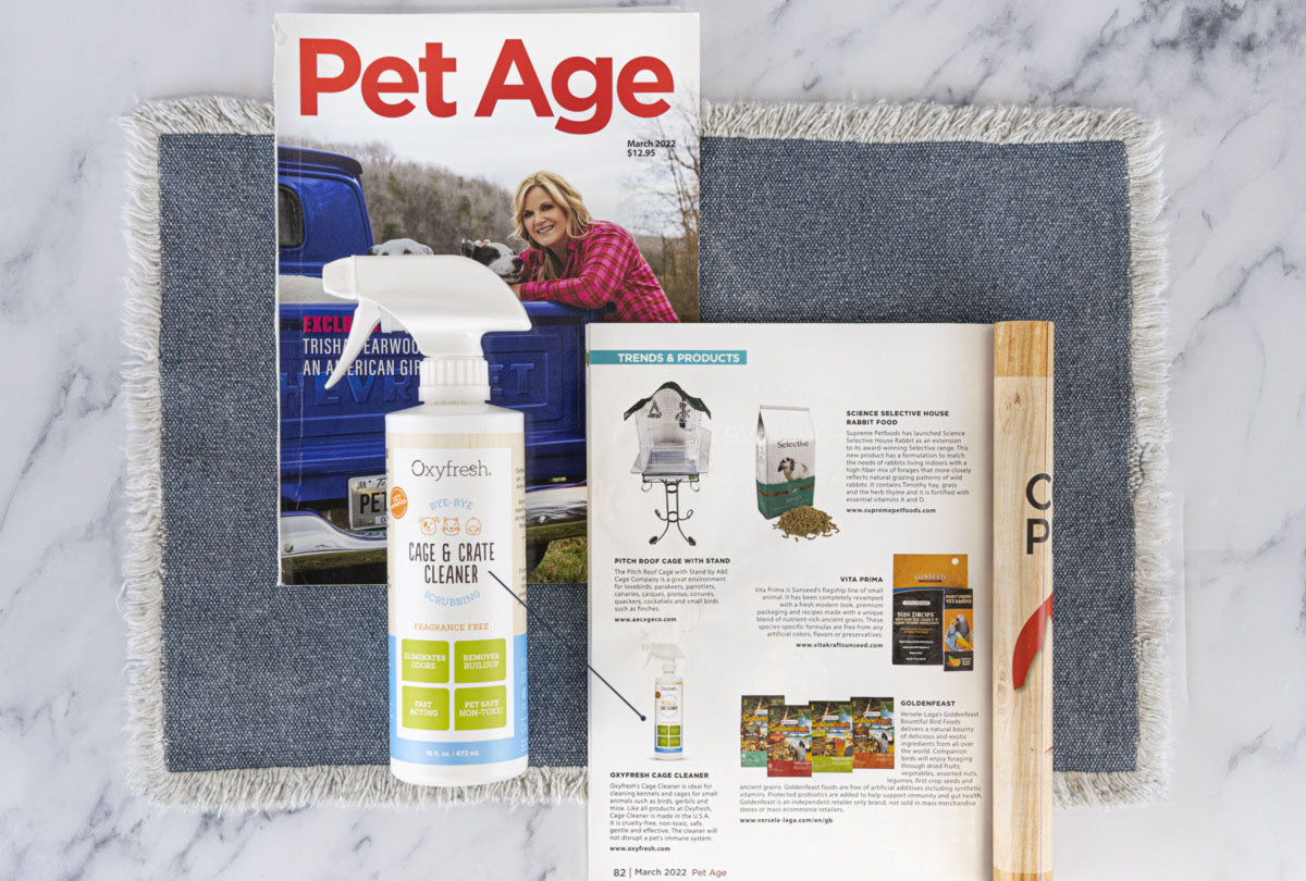 oxyfresh cage and crate cleaner next to article in Pet Age magazine