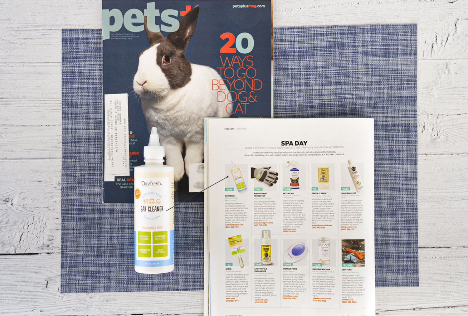 oxyfresh pet ear cleaner next to article in Pets+ magazine