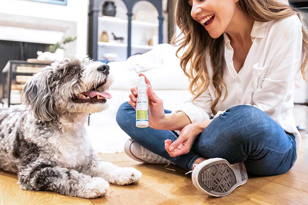 woman and dog smiling with oxyfresh pet dental breath spray