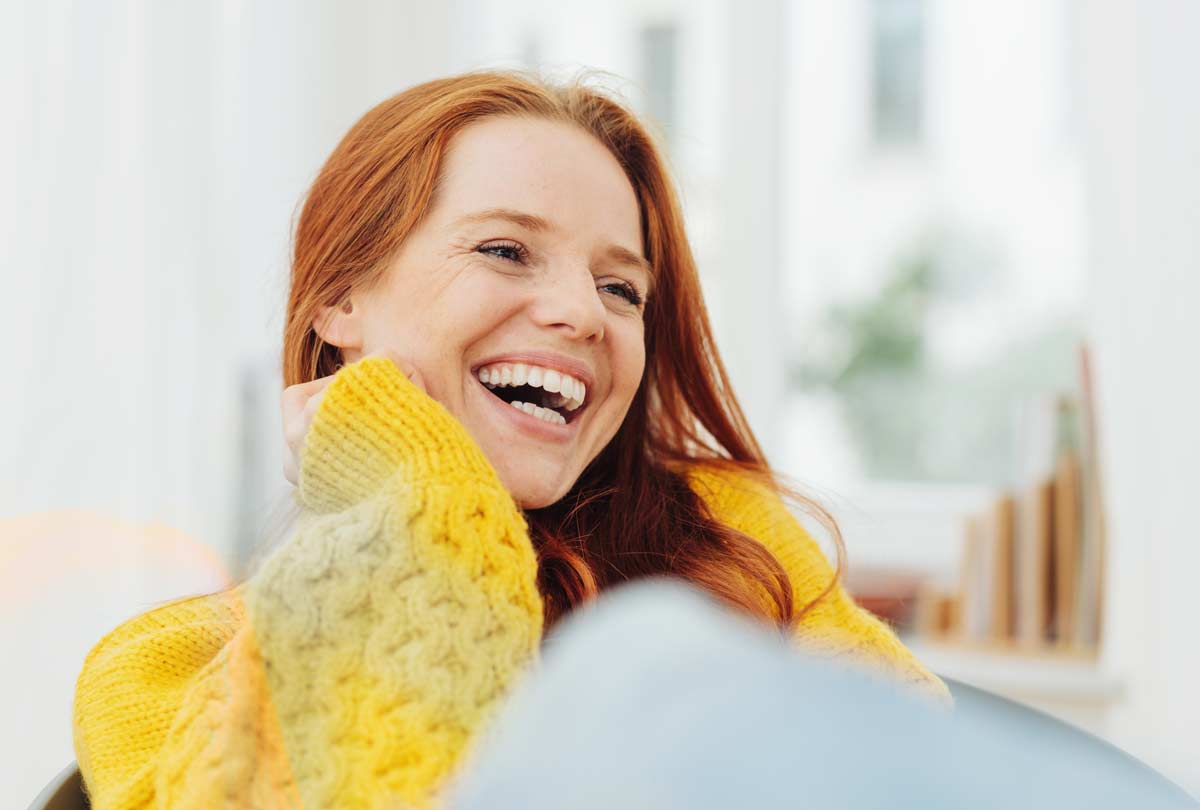woman-smiling-sweetly-featured-image-for-oxyfresh-blog-post-titled-What-Is-Non-Abrasive-Toothpaste-...-And-Why-Should-You-Be-Using-It