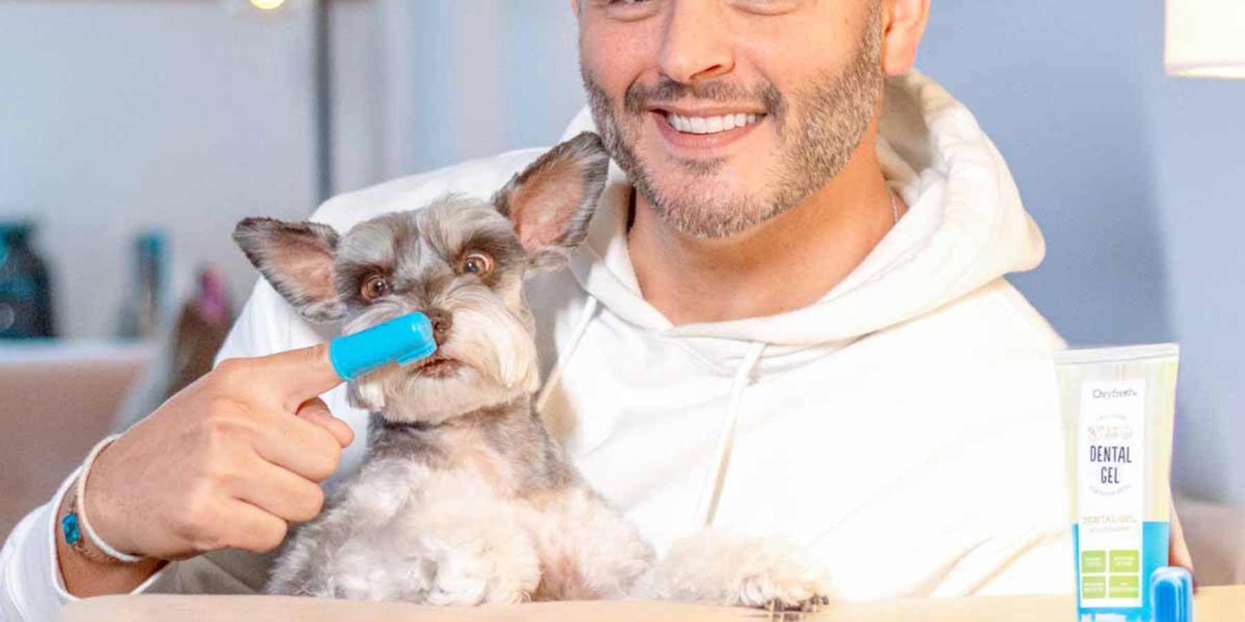 Social-Media-Post-From-Instagram-User-_vinniepotestivo-posing-with-his-shnauzer-who-is-looking-intently-at-the-oxyfresh-pet-toothpaste-gel-to-clean-his-teeth-and-eliminate-dog-bad-breath