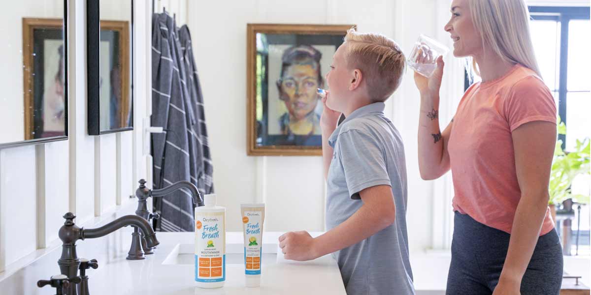 SON_AND-MOTHER-ENJOYING-THEIR-DENTAL routine with oxyfresh ultimate fresh breath kit