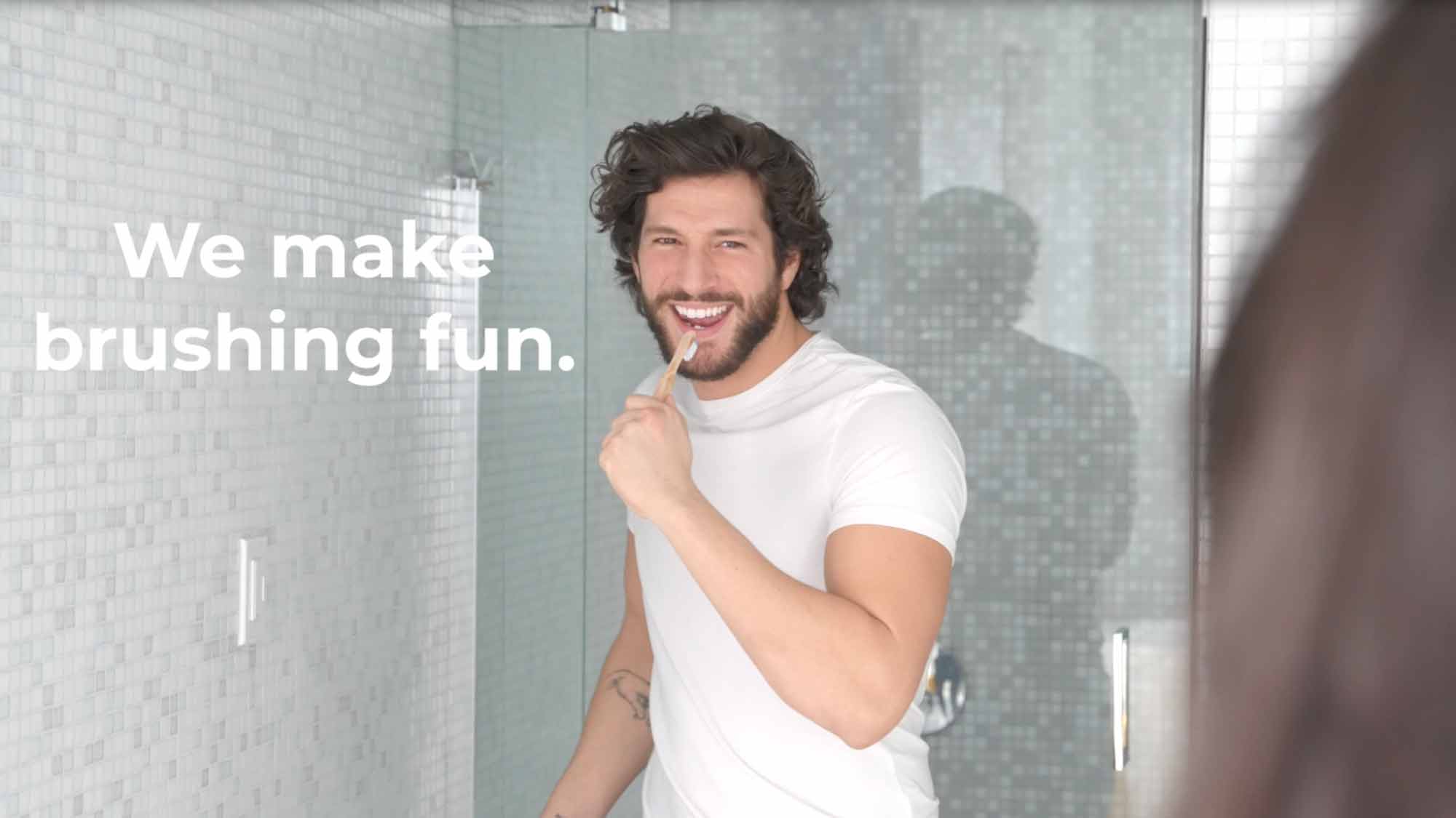 guy-in-bathroom-singing-using-toothbrush-as-a-mic-with-the-words-we-make-brushing-fun-oxyfresh.jpg