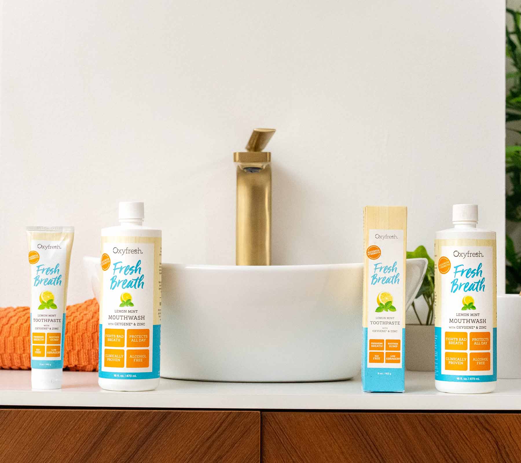 oxyfresh-fresh-breath-lemon-mint-product-line-up-next-to-modern-sink