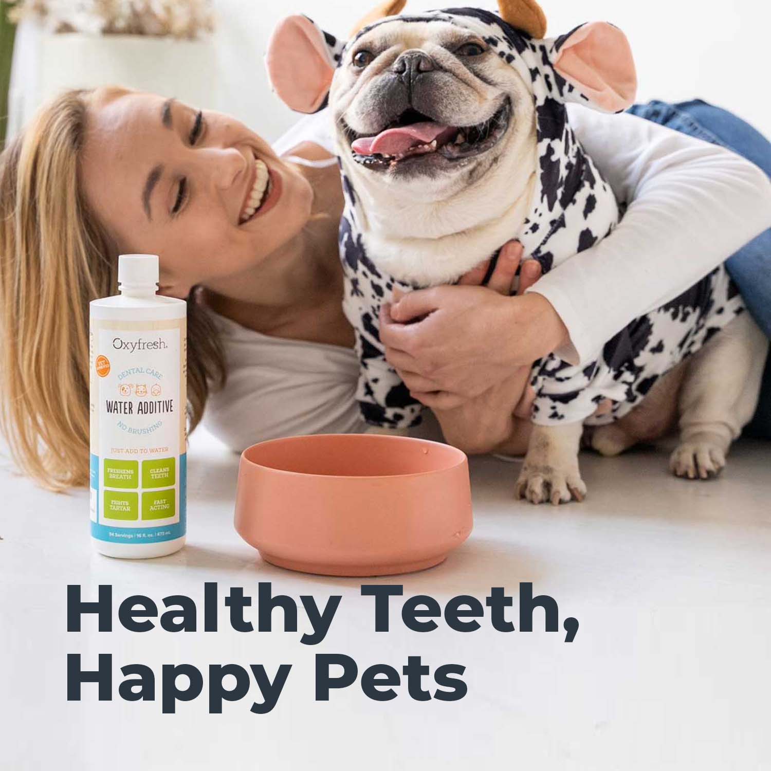 oxyfresh pet water additive for dog fresh breath image of woman smiling holding her bulldog close to his water bowl